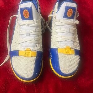 Nike LeBron White and Blue Sneakers with Yellow Accents